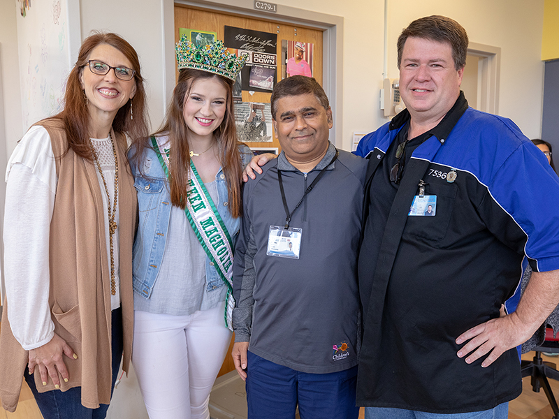 Dr. Ashley Bhatt, third from left, UMMC neonatologist, reunites with Savannah Richardson 18 years after the former patient left Batson Children’s Hospital. With them are Richardson’s parents, Jennifer and Bill.